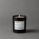 Vela aromática Happiness de Mittérium encendida, vaso negro de 230 g